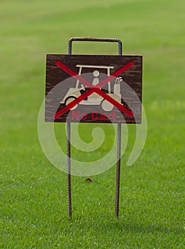 No cart sign on green.