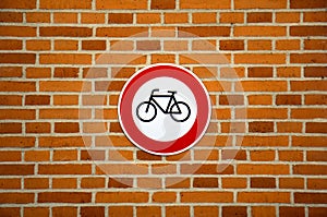 No cycling sign on brick wall