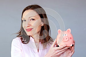 Money savings no stress woman holding moneybox piggy bank