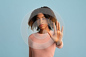 No Discrimination. Portrait Of Serious Black Woman Showing Stop Gesture At Camera