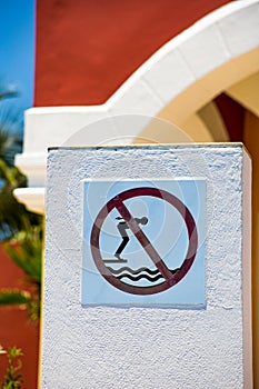 No diving ion swimming pool warning sign close up