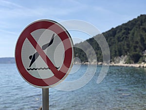 No diving sign at Kasjuni beach