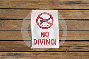 No Diving warning sign on wood photo photo