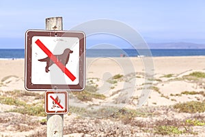 No dogs and campfires on the beach sign. photo