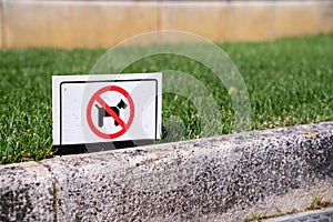 No dogs with dog crossed out sign on freshly manicured lawn