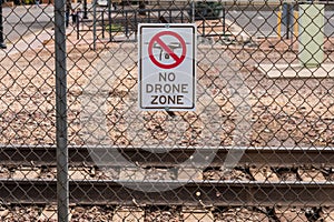 No Drone Zone sign on a fence