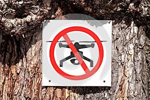No drone zone sign on the tree. Drone flights prohibited
