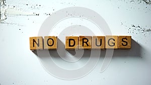 No drugs words on wooden cubes, harmful addiction, abuse and social problem