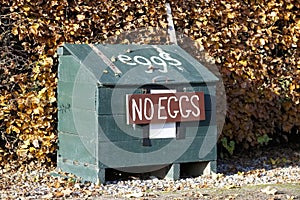 No eggs for sale sign on farm box due to shortage of produce
