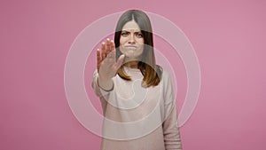 No, enough! Angry brunette young woman confidently showing stop gesture, warning of danger, blocking
