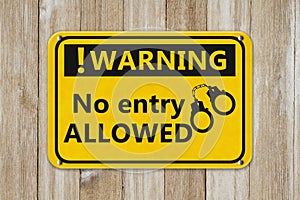 No Entry Allowed warning sign with handcuffs