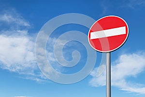 No entry round traffic sign in front of blue sky