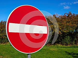 No entry sign with clear blue sky background