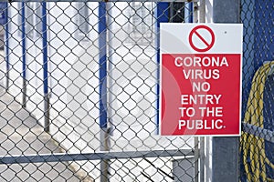 No entry to the public coronavirus covid-19 safety sign at place of work factory entrance