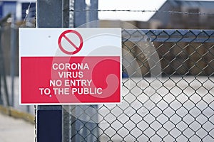 No entry to the public coronavirus covid-19 safety sign at place of work factory entrance