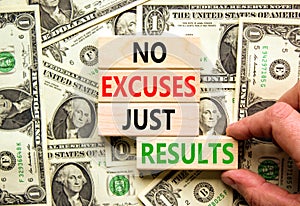No excuses just results symbol. Concept words No excuses just results on blocks. Businessman hand. Beautiful background from