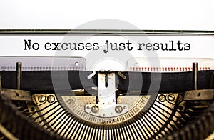 No excuses just results symbol. Concept words No excuses just results typed on retro typewriter. Beautiful white background. No