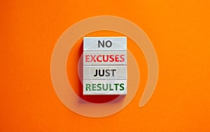 No excuses just results symbol. Concept words No excuses just results on wooden blocks. Beautiful orange table orange background.