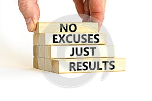 No excuses just results symbol. Concept words No excuses just results on wooden blocks. Businessman hand. Beautiful white table