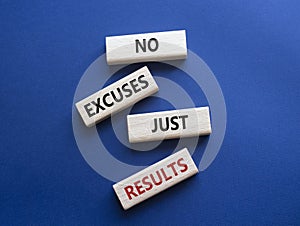 No excuses just results symbol. Wooden blocks with words No excuses just results. Beautiful deep blue background. Business and No