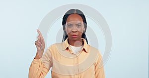 No, finger and face of woman in studio with head shake for stop, wrong and warning on white background. Portrait, hand