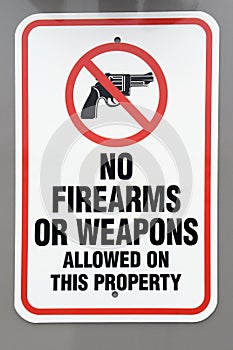No firearms or weapons warning sign photo