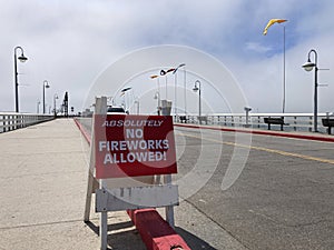 No Fireworks Allowed outdoors sign on public pier