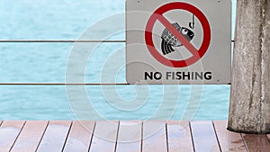 No fishing sign on fence