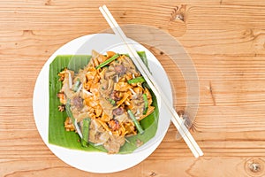 No frills simple Chinese Char Kway Teow or Fried Noodle on banana leaf