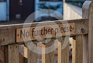 No further please. Sign on wooden gate. Wisley, Surrey.