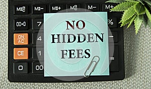 NO HIDDEN FEES - word on the note sheet on the background of the calculator