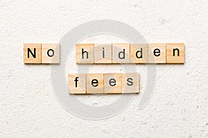 no hidden fees word written on wood block. no hidden fees text on table, concept