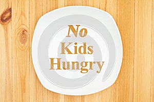 No Kids Hungry message on white empty plate