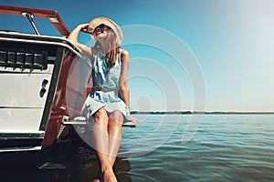 No limit to happiness out on the water. an attractive young woman spending the day on her private yacht.