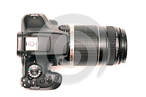 No logos digital SLR camera with large telephoto lens. Top view, studio shooting