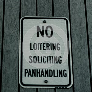 No loitering soliciting panhandling text sign