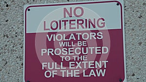 no loitering violators will be prosecuted to the full extent of the law writing
