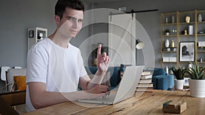 No, man rejecting offer by waving finger at work