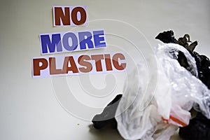No more plastic message. It shows a plastic with motto and selective focus no more plastic text