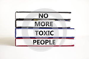 No more toxic people symbol. Concept words No more toxic people on books on a beautiful white table white background. Business,