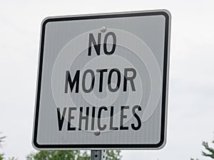 No motor vehicle sign in park photo