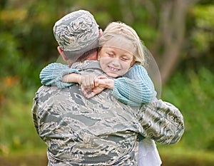 No one knows you better than your family does. Shot of a father returning from the army hugging his daughter outside.