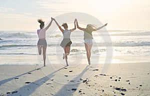 No one loves the beach as much as we do. three friends spending the day at the beach.