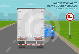 No overtaking by heavy goods vehicles sign meaning. Back view of semi-trailer on road.