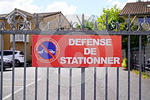 No parking means in french defense de stationner text and sign Do not park in front of residential gate