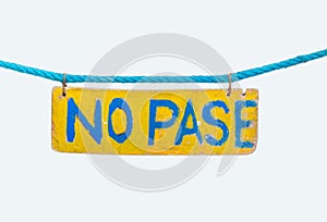 No parking no pase sign hanging on rope photo