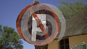 No Parking. Old rusty iron road sign. Abandoned road in the desert in Africa.