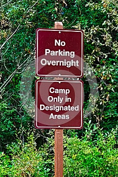 No parking overnight, camp in designated areas sign