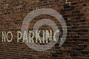 No Parking on Red Brick Wall in the Alley in the City