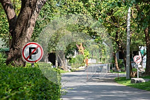 No parking sign with national park in background.